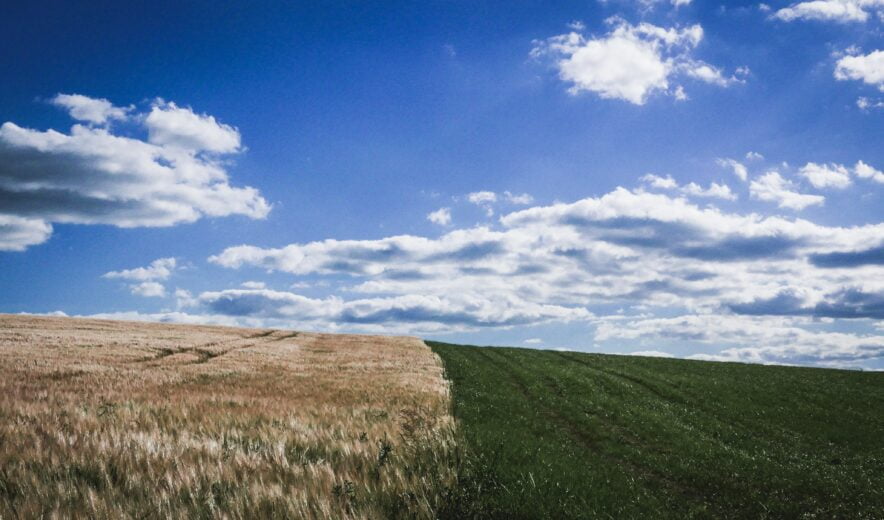 image of the countryside with clear skies with some clouds