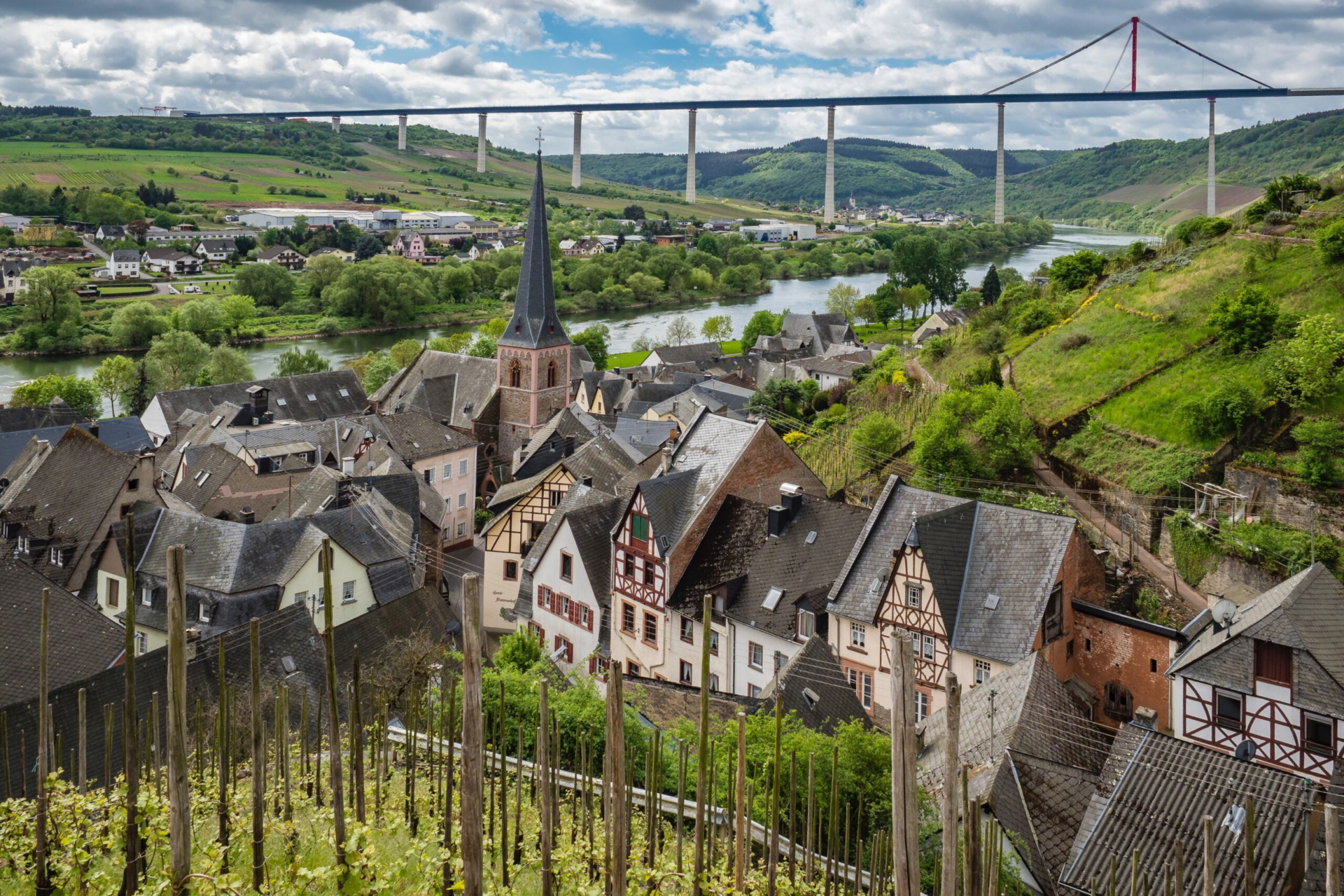 a view of a small town in the mountains and a valley